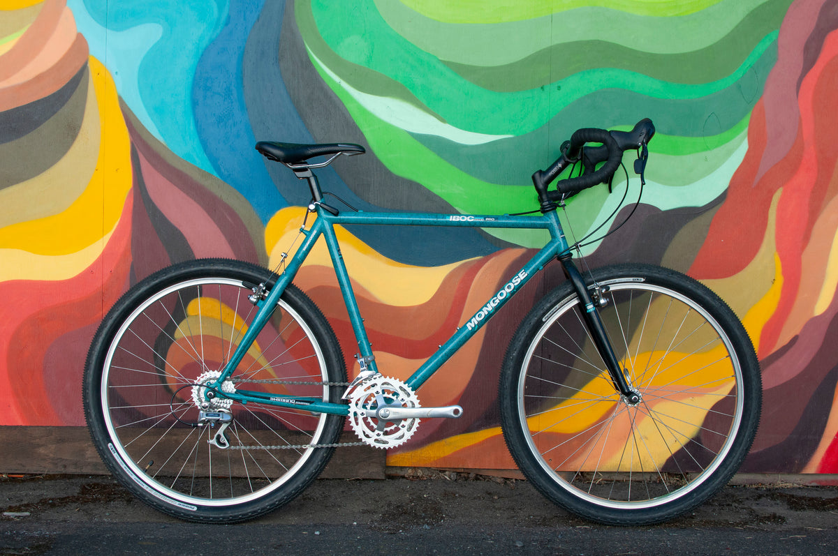 boc gravel bike Mongoose IBOC Series Pro, 51cm Bike, Teal – Cycle & Coffee Praktische, manipulationssichere und sichere fork-brand__fox precise and stable Model Number:24V 5 RPM (Eccentric Shaft)